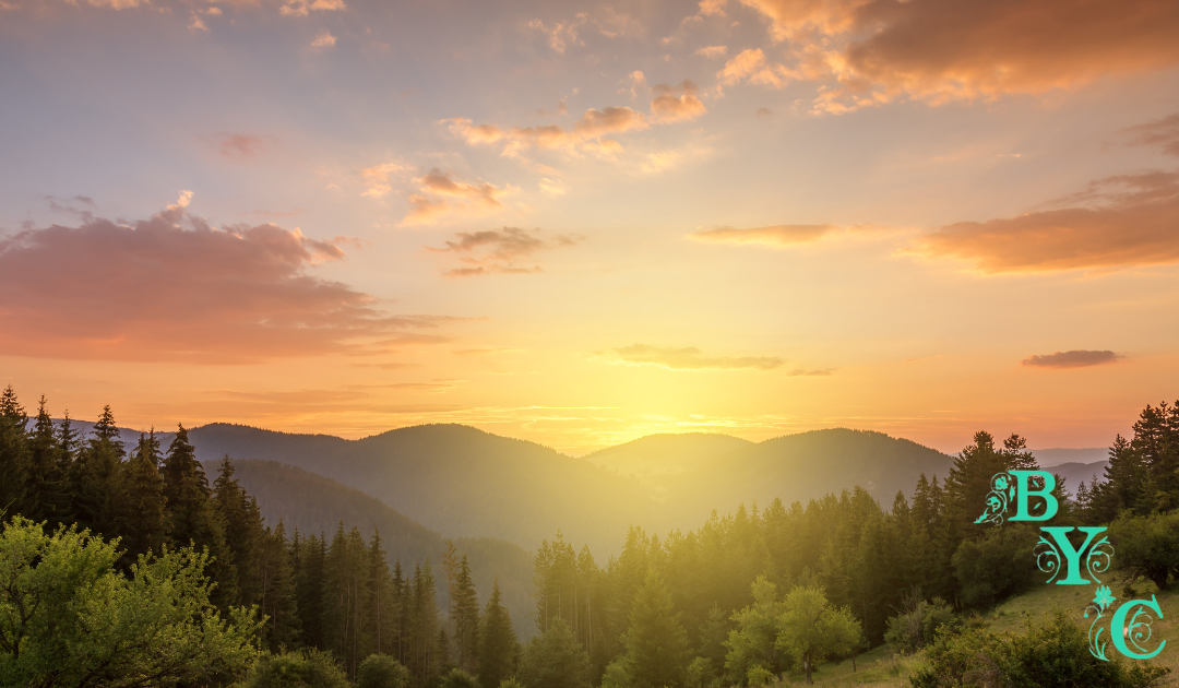 photo of sunrise cresting the mountains